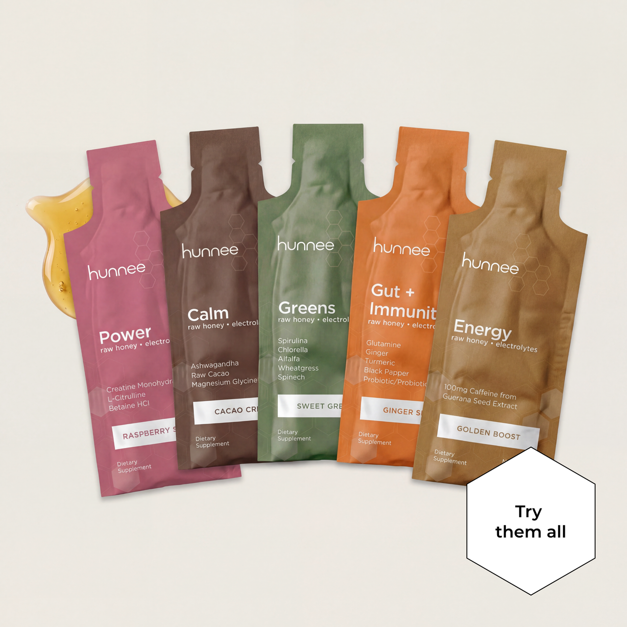 Five hunnee supplement packets in various flavors on a light background
