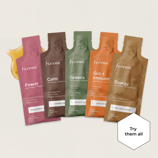 Five hunnee supplement packets in various flavors on a light background