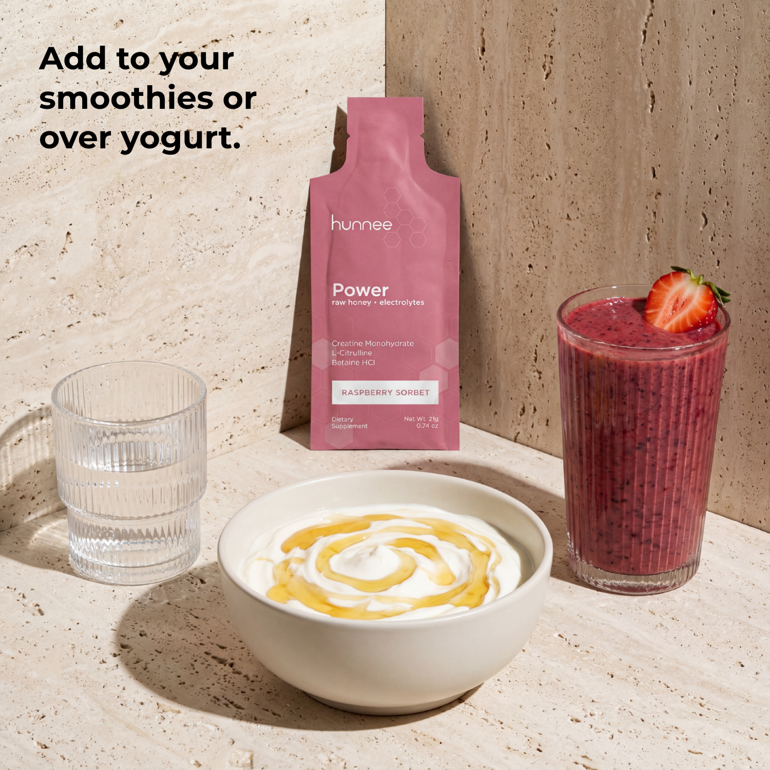 Hunnee Power package with a smoothie, yogurt, and glass on a neutral background