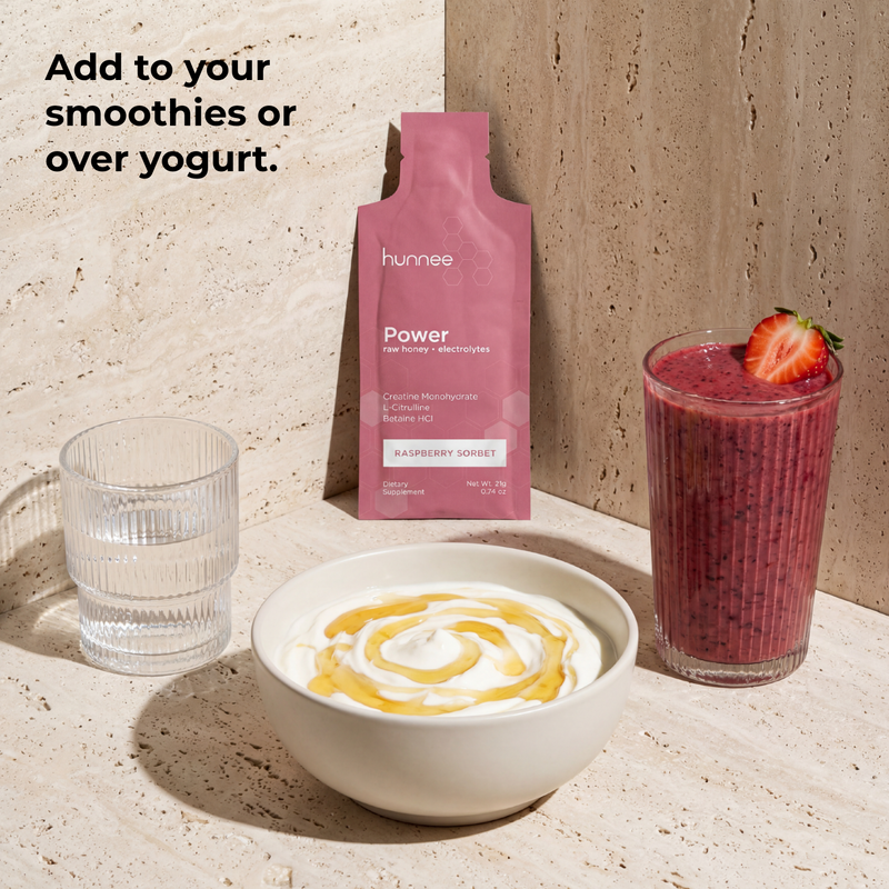 Hunnee Power package with a smoothie, yogurt, and glass on a neutral background