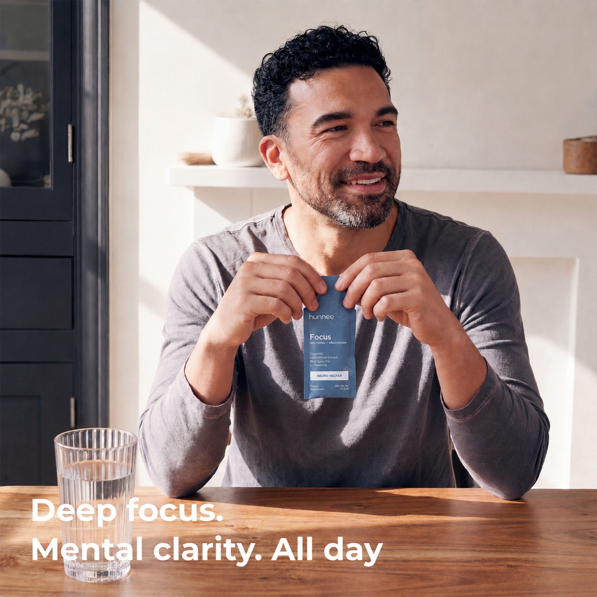 man holding a hunnee focus sachet at a desk